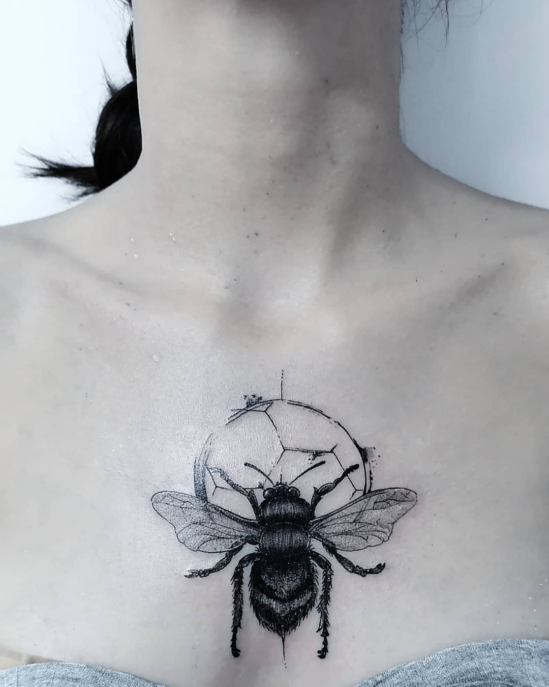 Bee tattoo on the chest