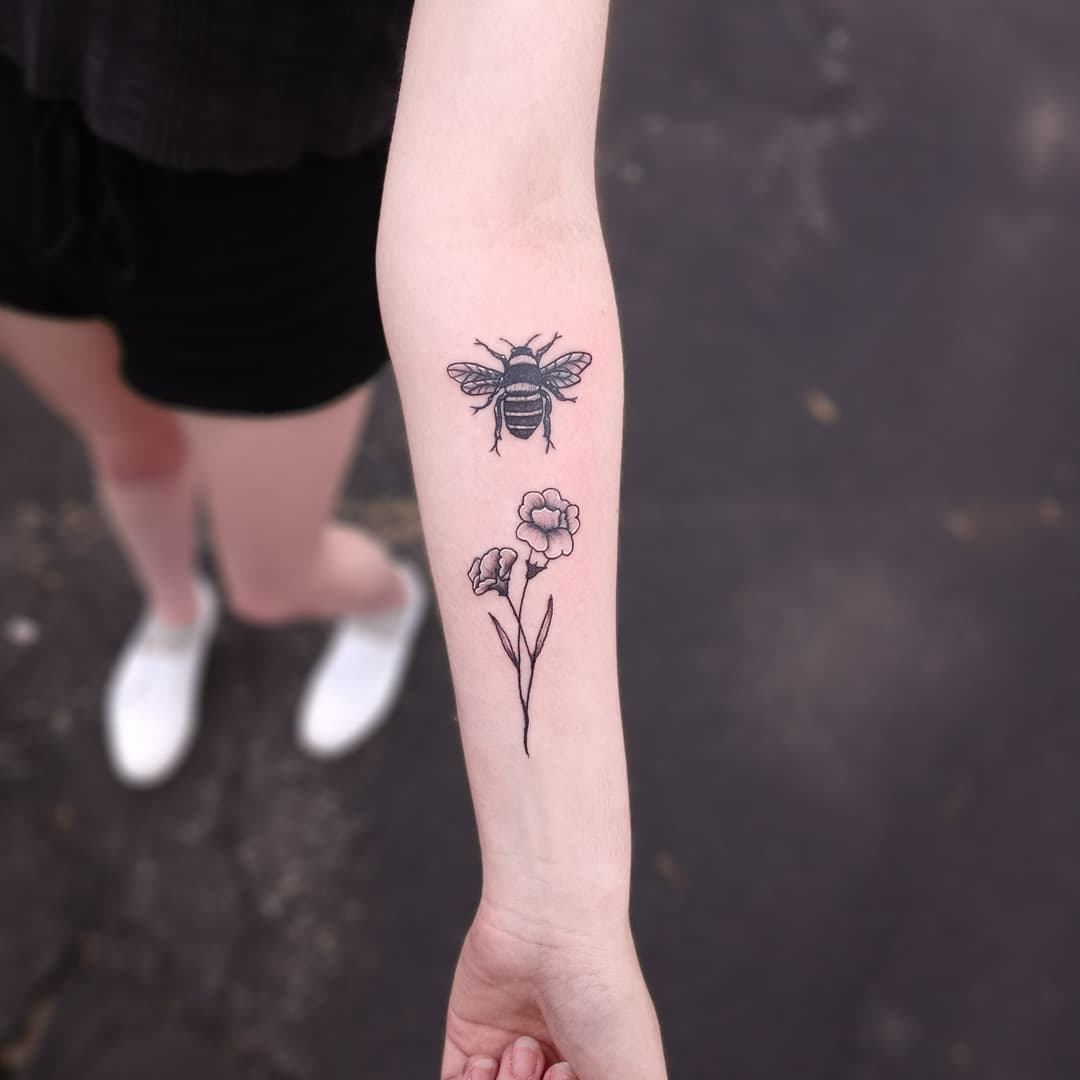 Black bee tattoo