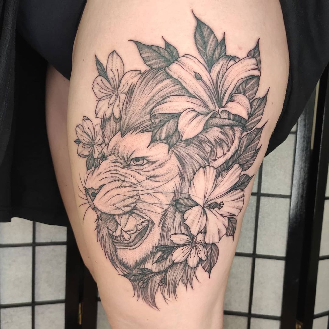 Lion Tattoo Thigh lion like flowers