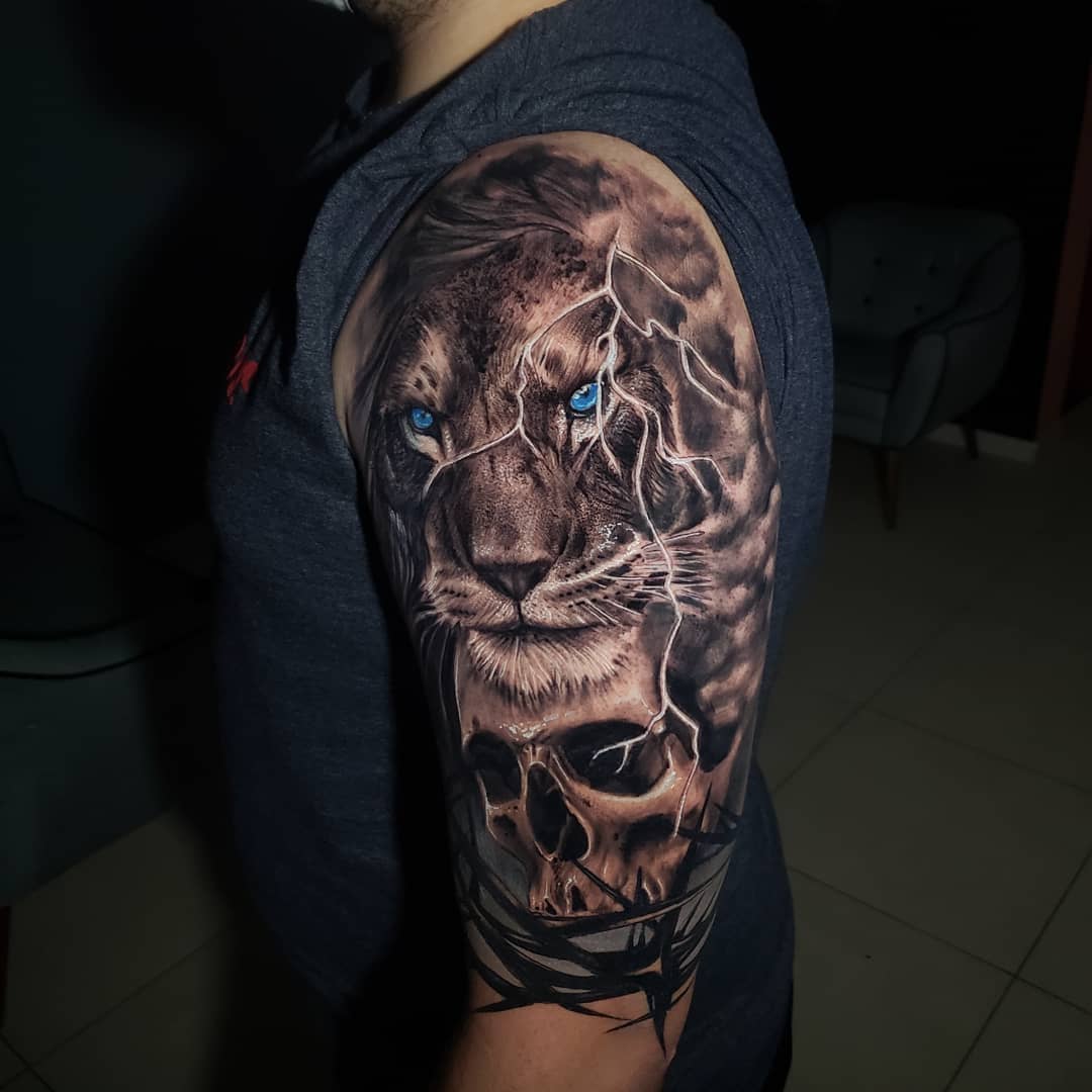 Lion and skull on arm