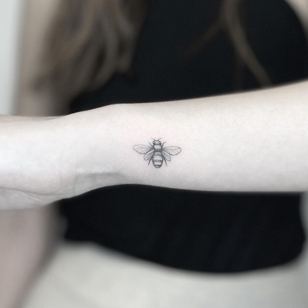 Tiny bee tattoo