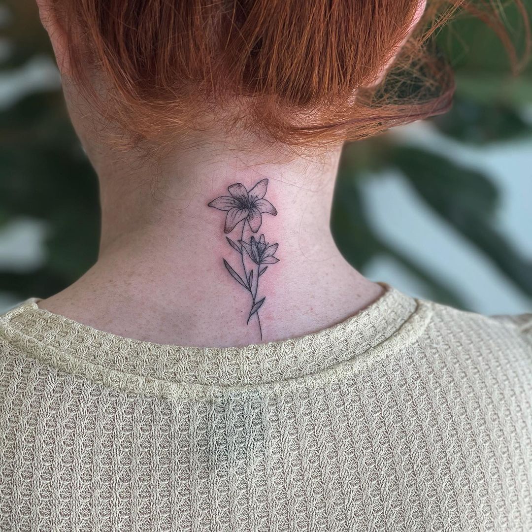 Back Small & Black Lily Tattoo