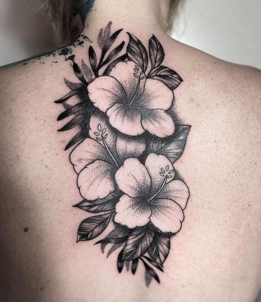 Flower Upper Back Tattoo