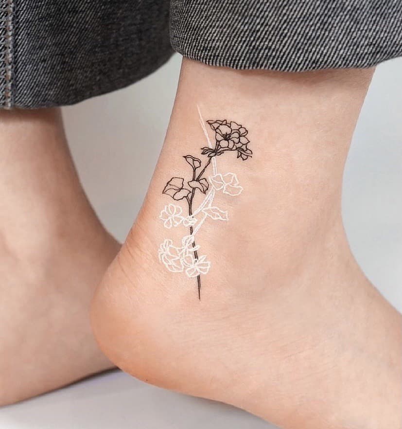 White Ink Tattoos On Dark Skin hero tattoo Ankle 1
