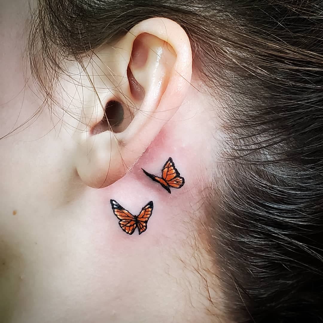 Butterfly behind the tattoo hero tattoo