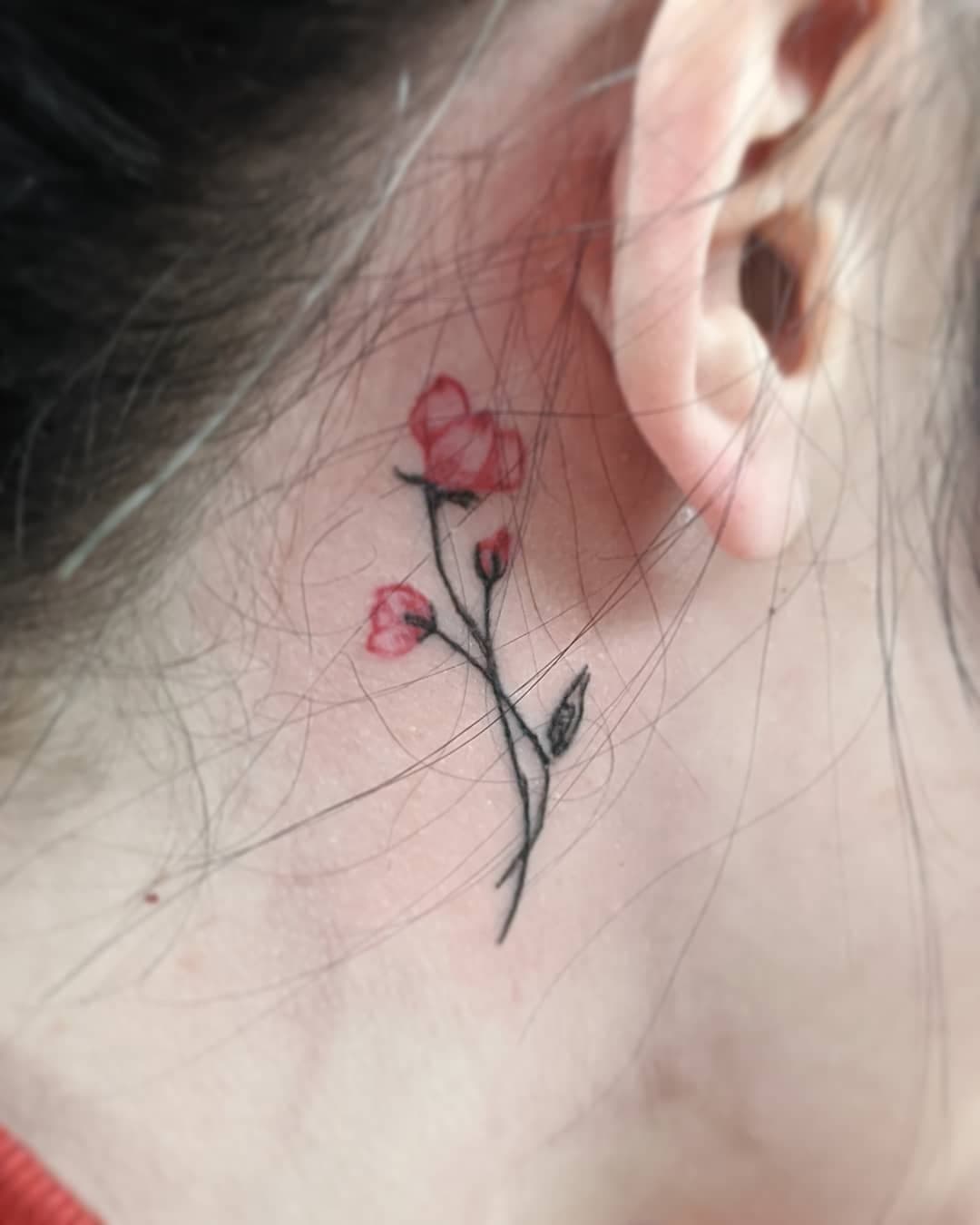 Flower behind the tattoo hero tattoo
