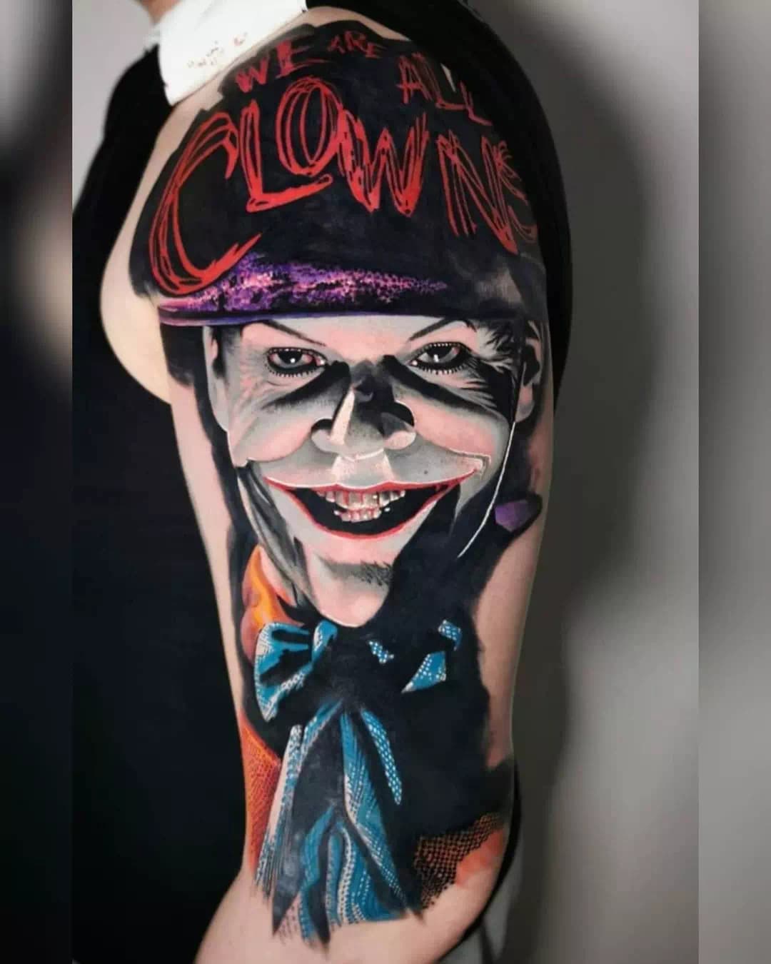 Joker Face Tattoo Over Arm Red Ink