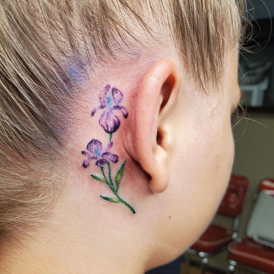 Lila flower behind the tattoo hero tattoo 1