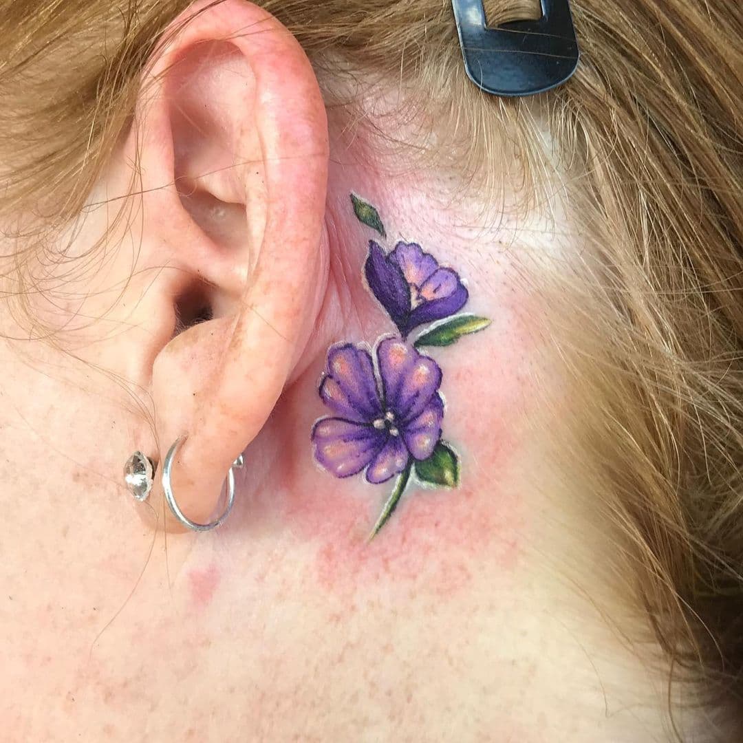 Lila flower behind the tattoo hero tattoo 2