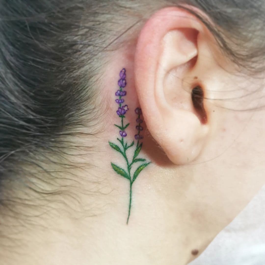 Lila flower behind the tattoo hero tattoo