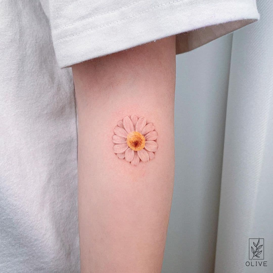 cover Birthmarks with a daisy tattoo