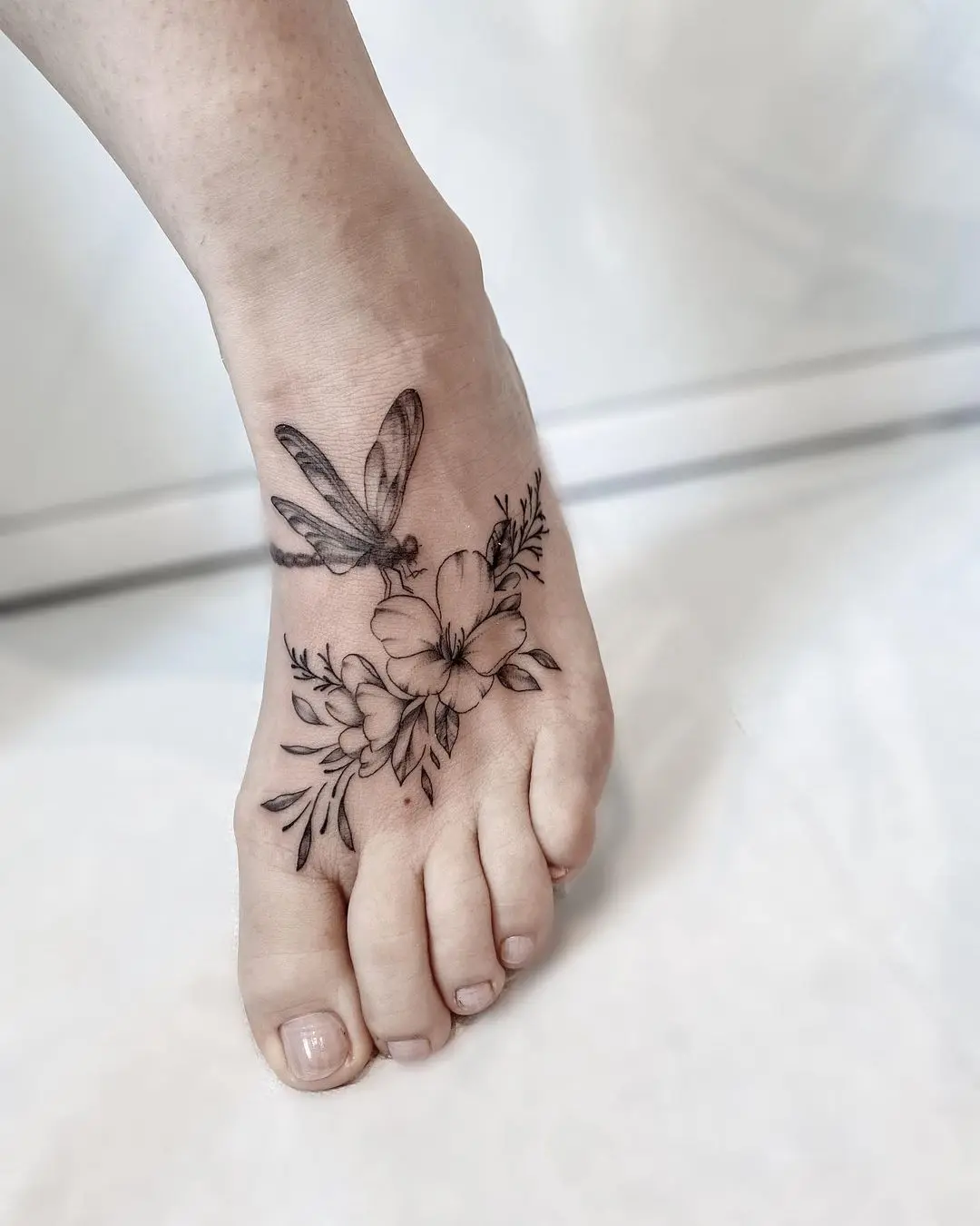 flower tattoo on foot