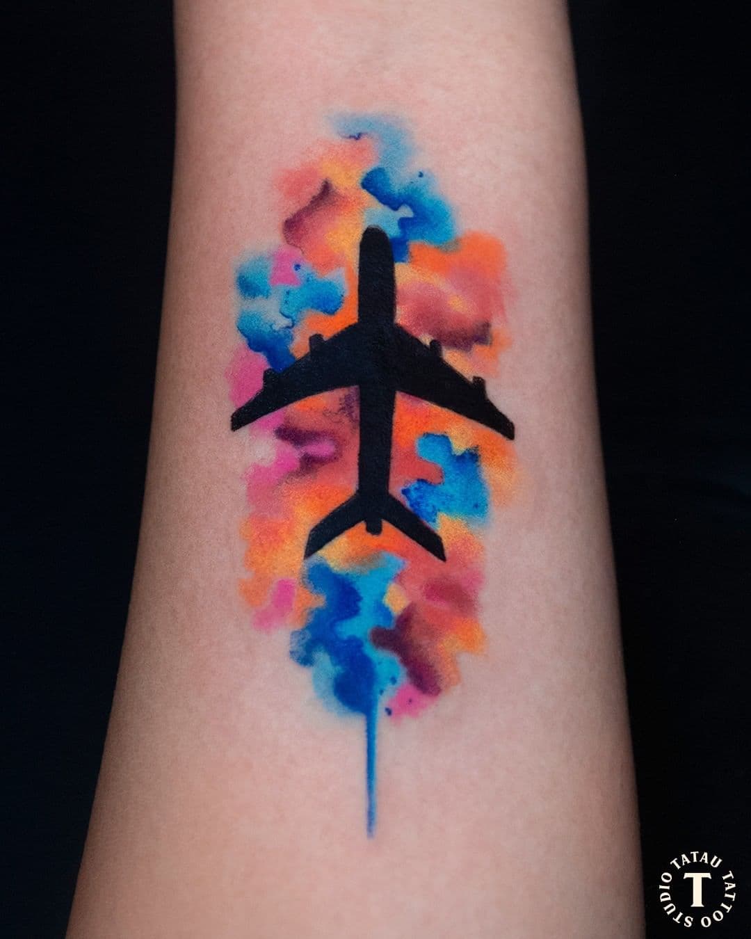 Artsy Colorful Airplane Tattoo On Arm