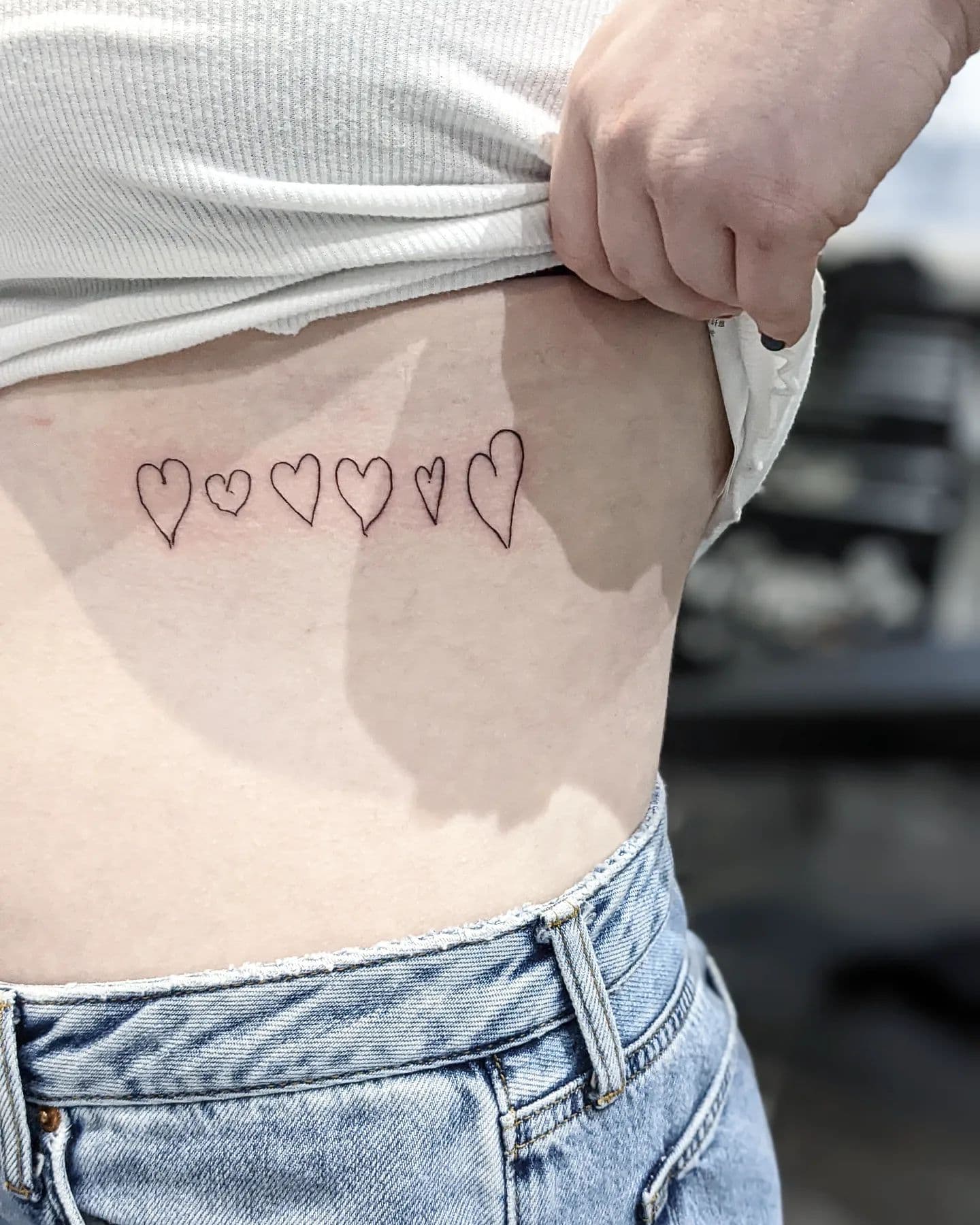 Tatuaje familiar con el símbolo del corazón
