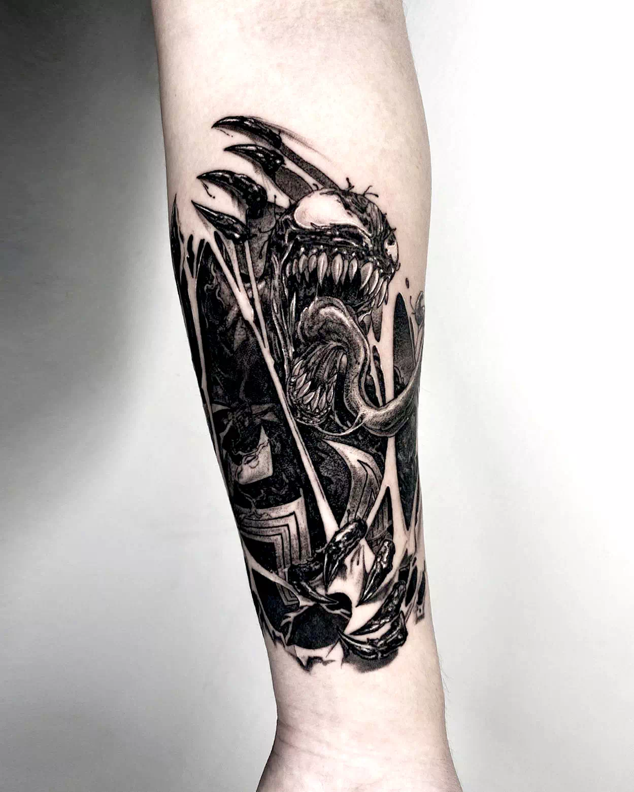 venom arm tattoo