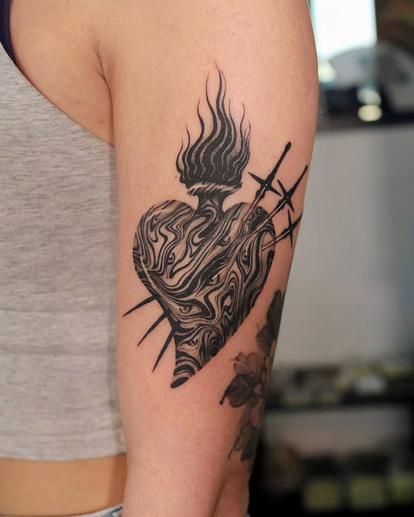 Leg Heart Tattoo With A Fire Symbol