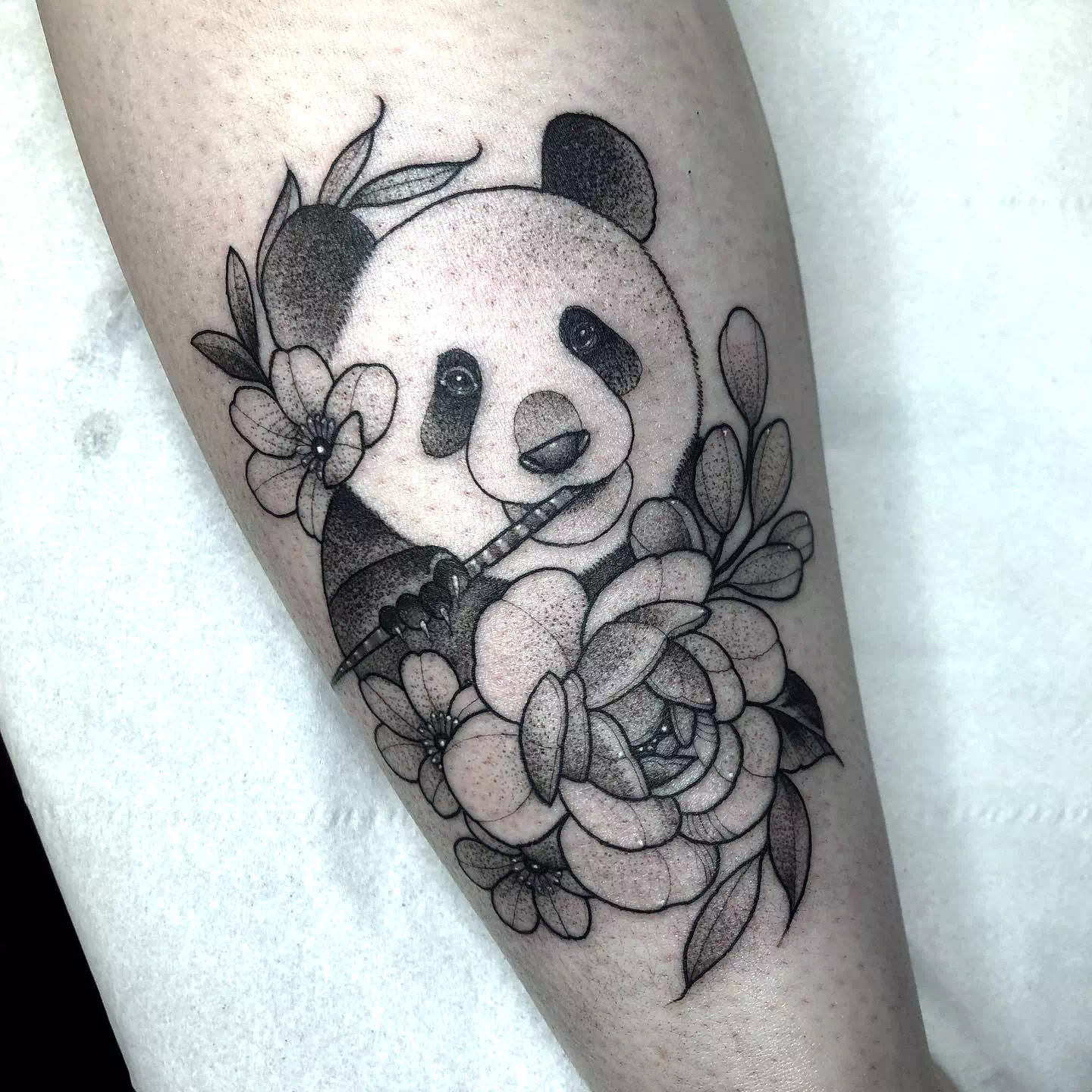 Panda Baby Tattoo On Chest With Flowers