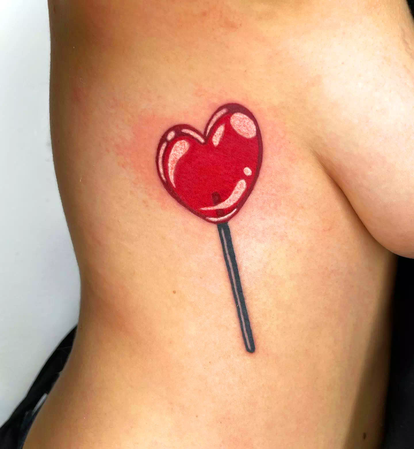 red lolipop heart tattoo idea