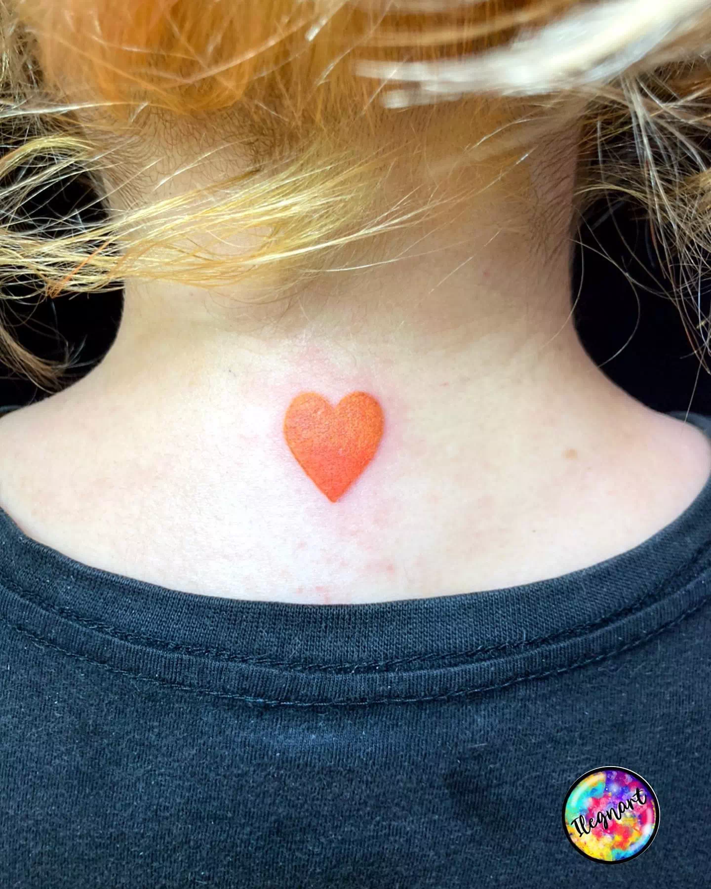 tiny heart tattoo on back