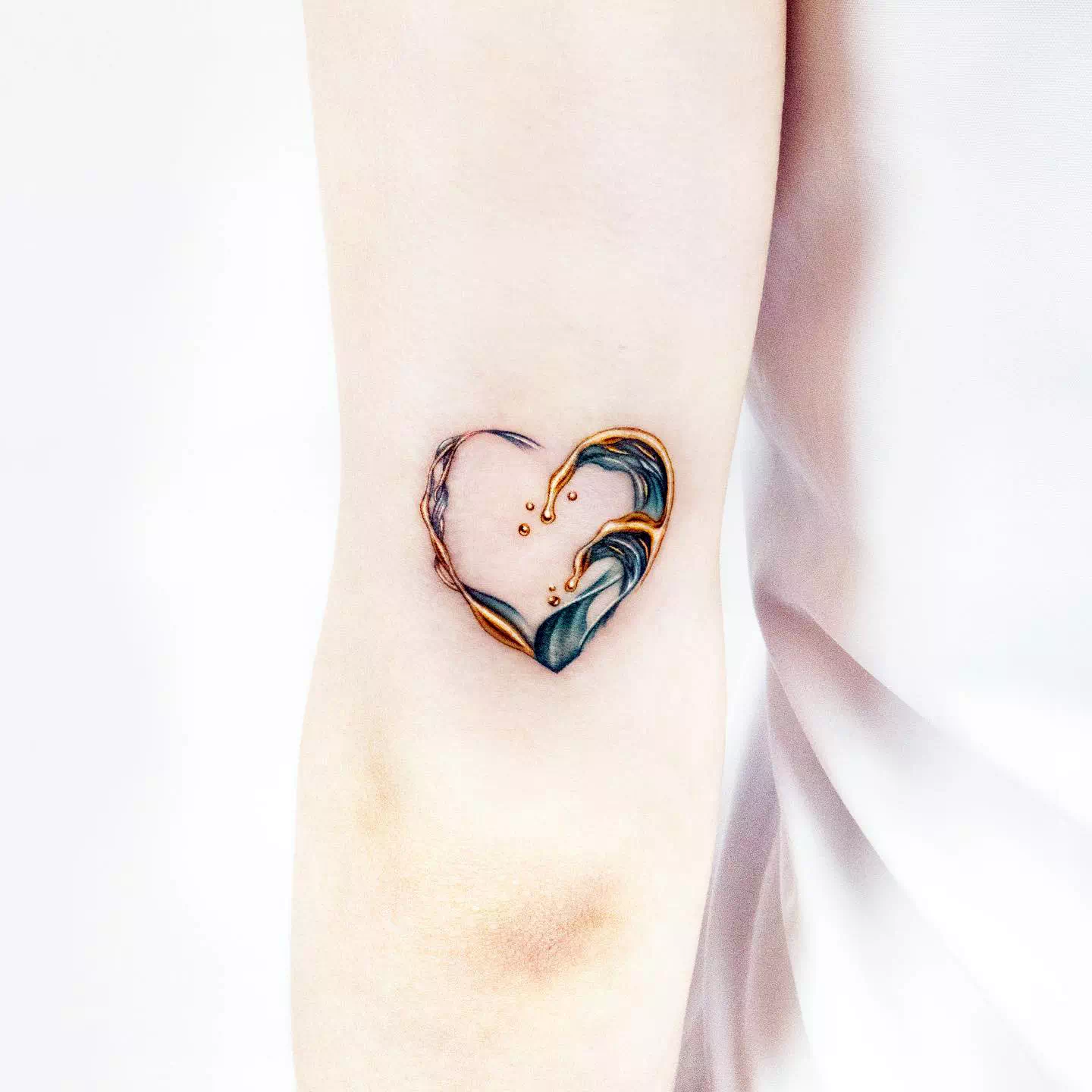 wave in heart tattoo