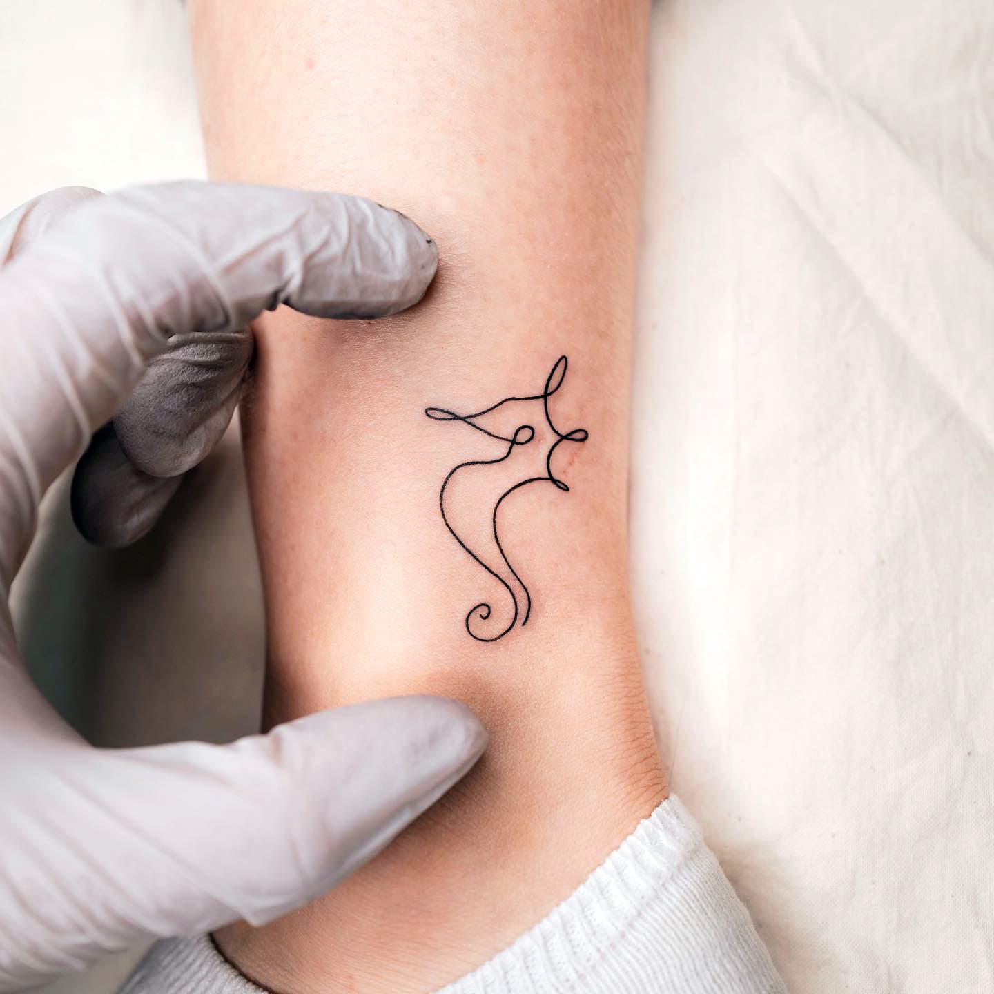 Black Ink Foot Seahorse Tattoo