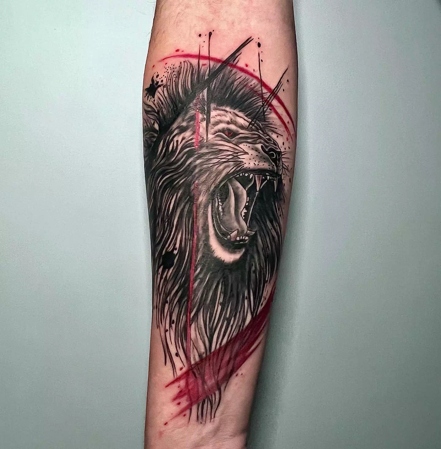 Lion Inspired Trash Polka Tattoos