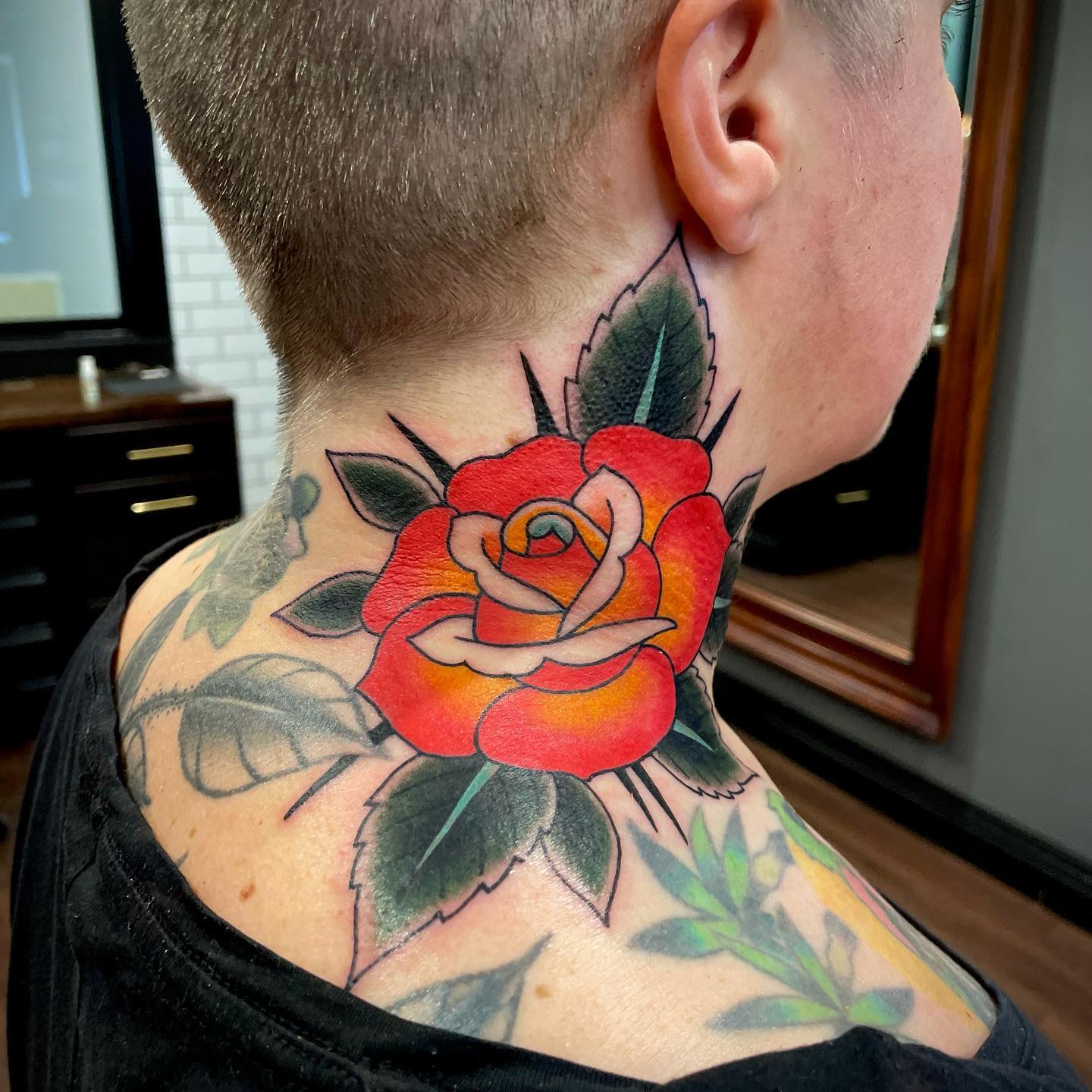 Red tattoo on the neck of women