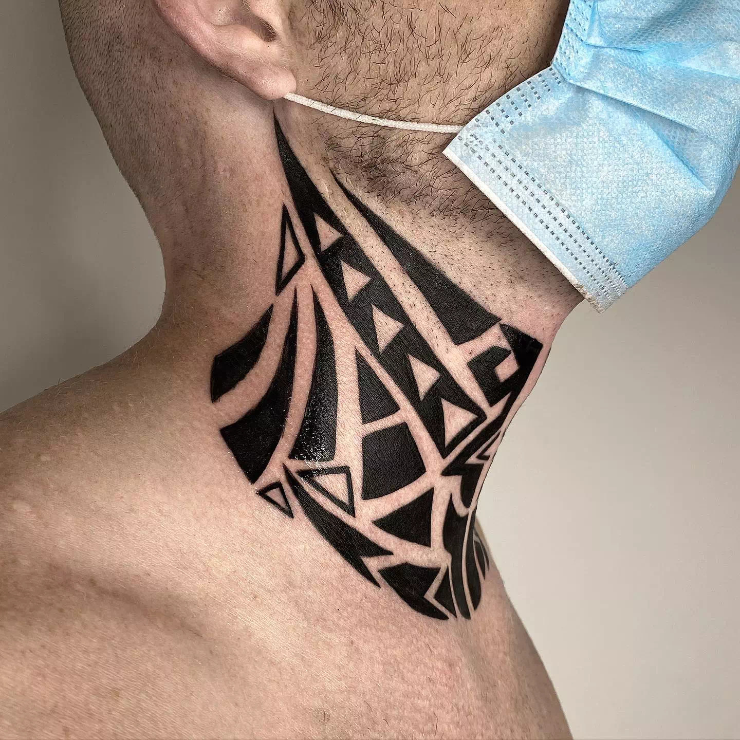 Tribal neck tattoo 1