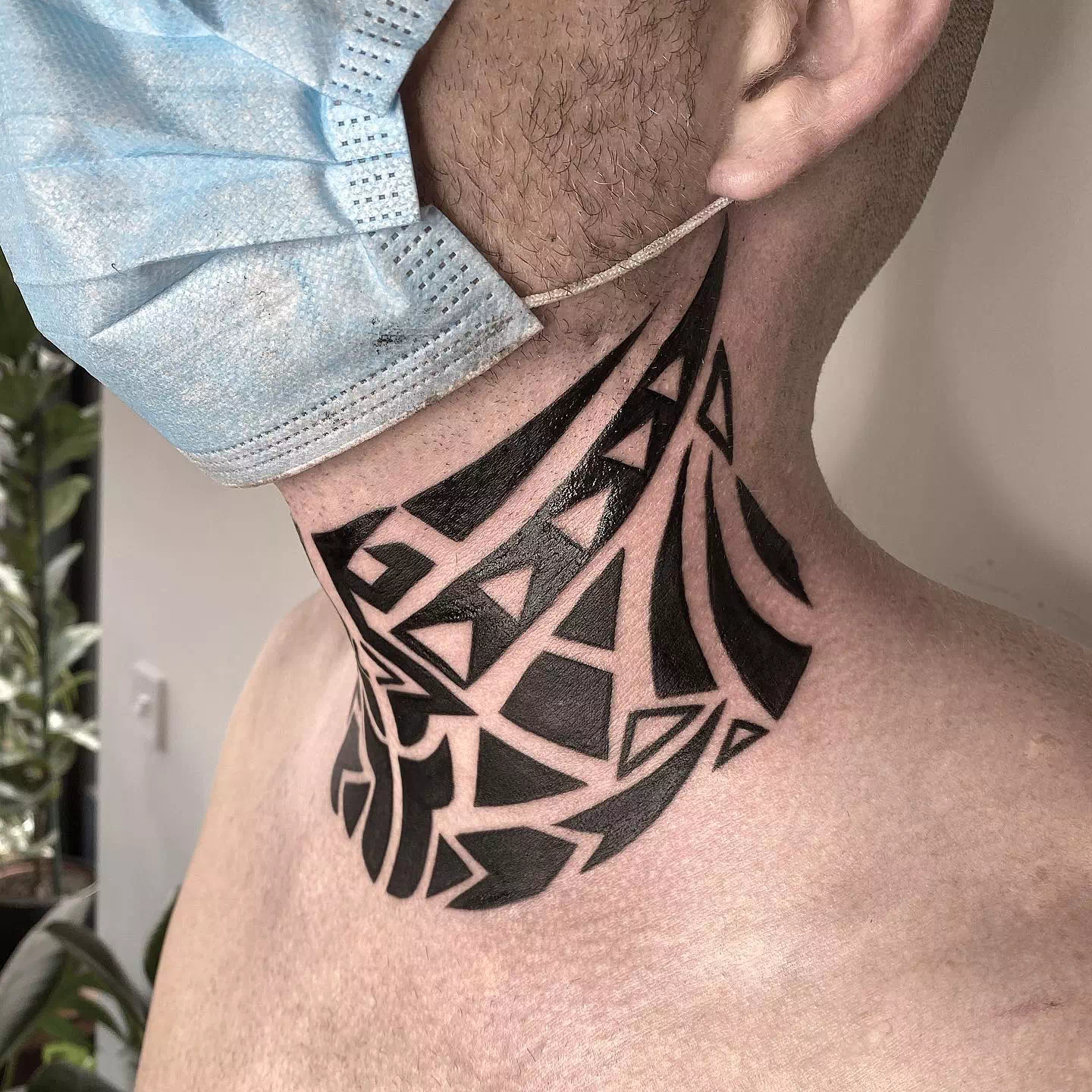 Tribal neck tattoo 2