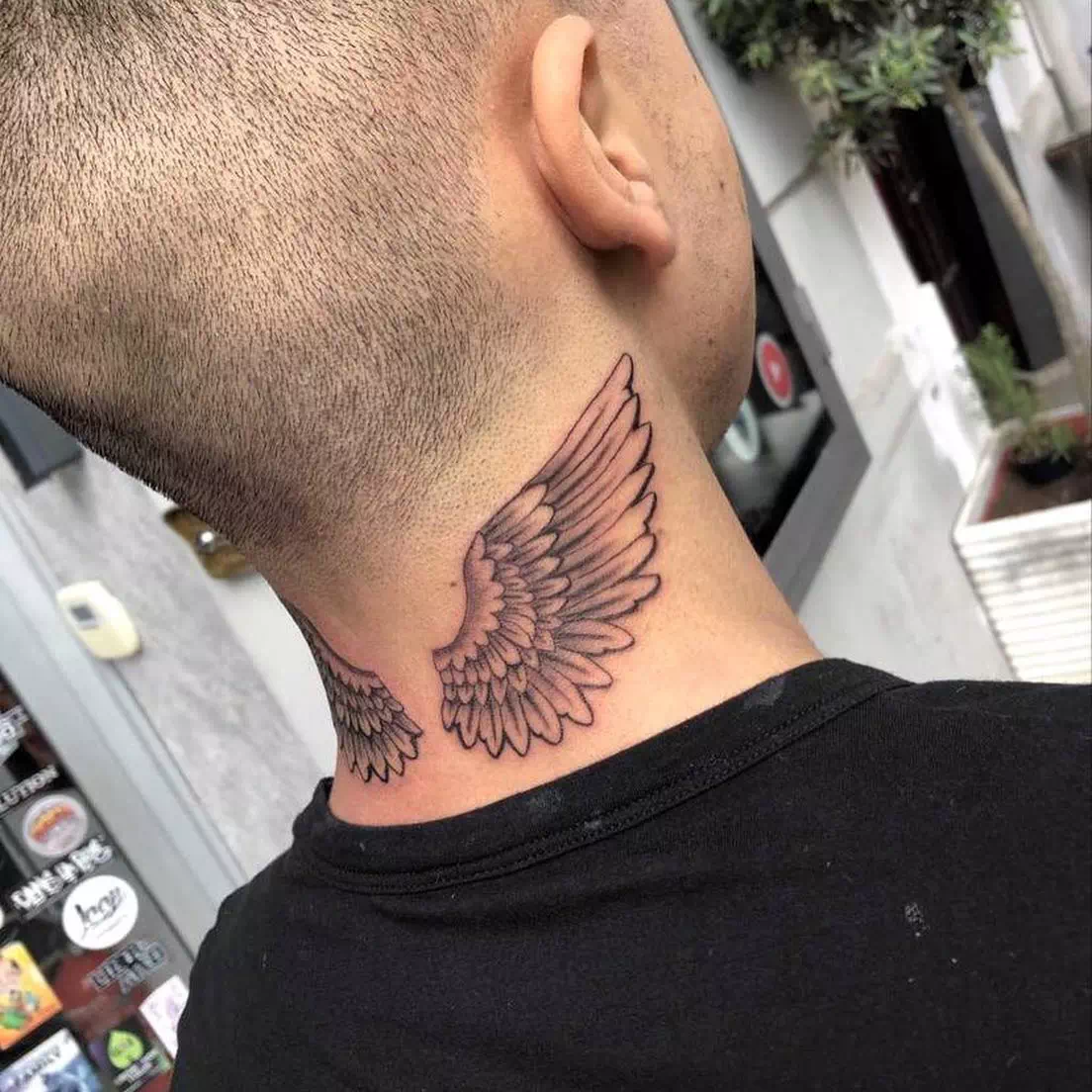 Wing neck tattoo 2
