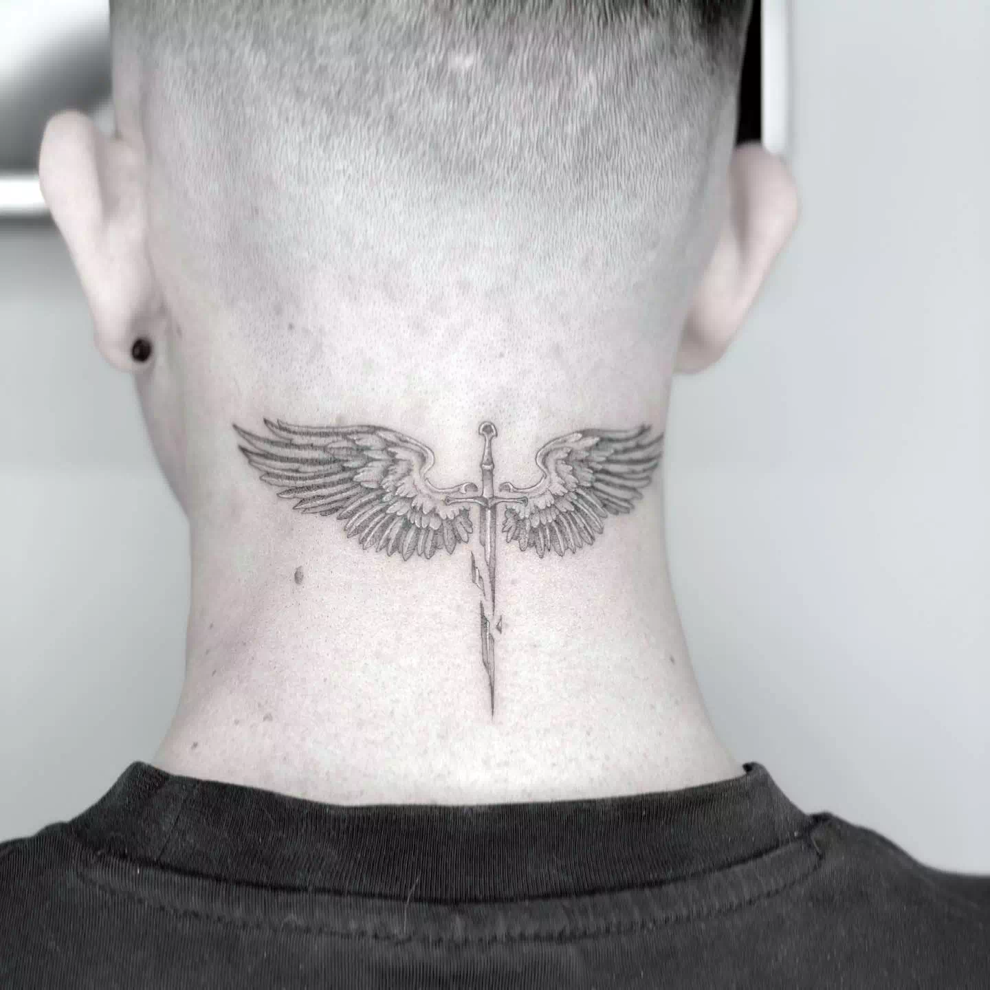 Wing neck tattoo 5