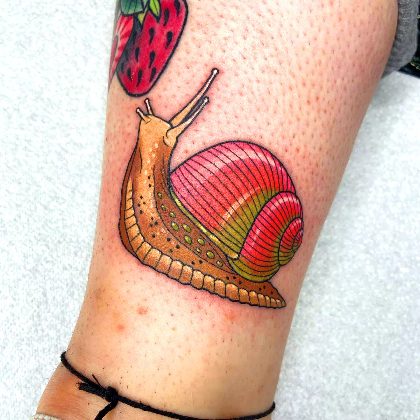 Colorful Red Snail Calf Tattoo 1
