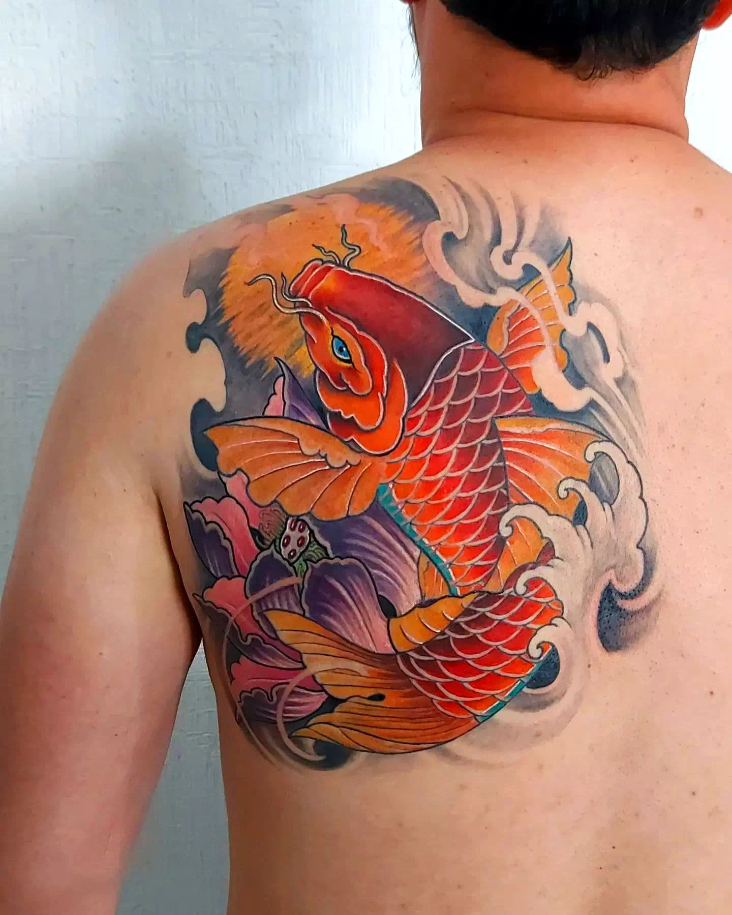 Beste Koi Fisch Tattoo Designs für Männer 4