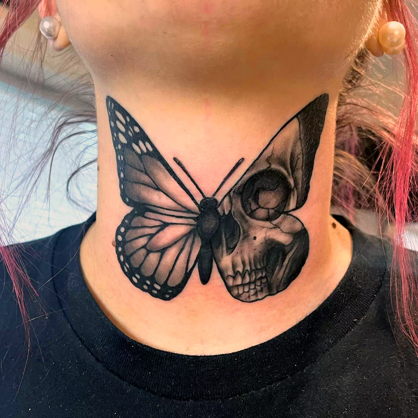 Butterfly neck tattoo 1