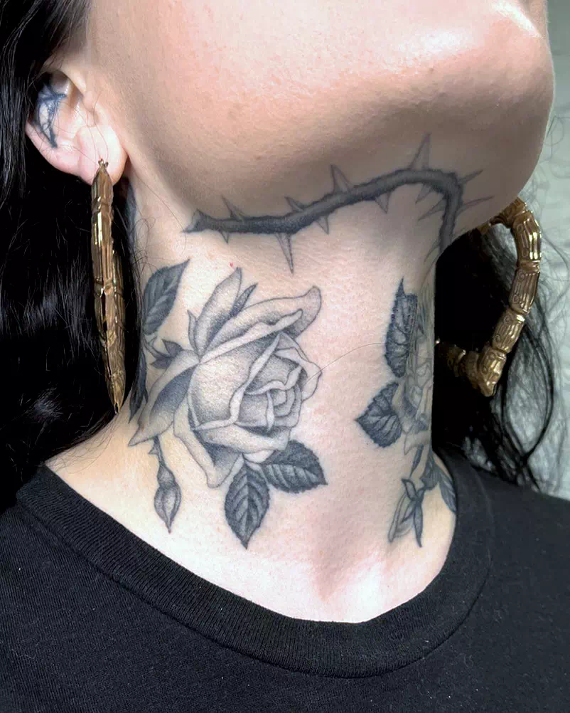 Flower neck tattoo 1