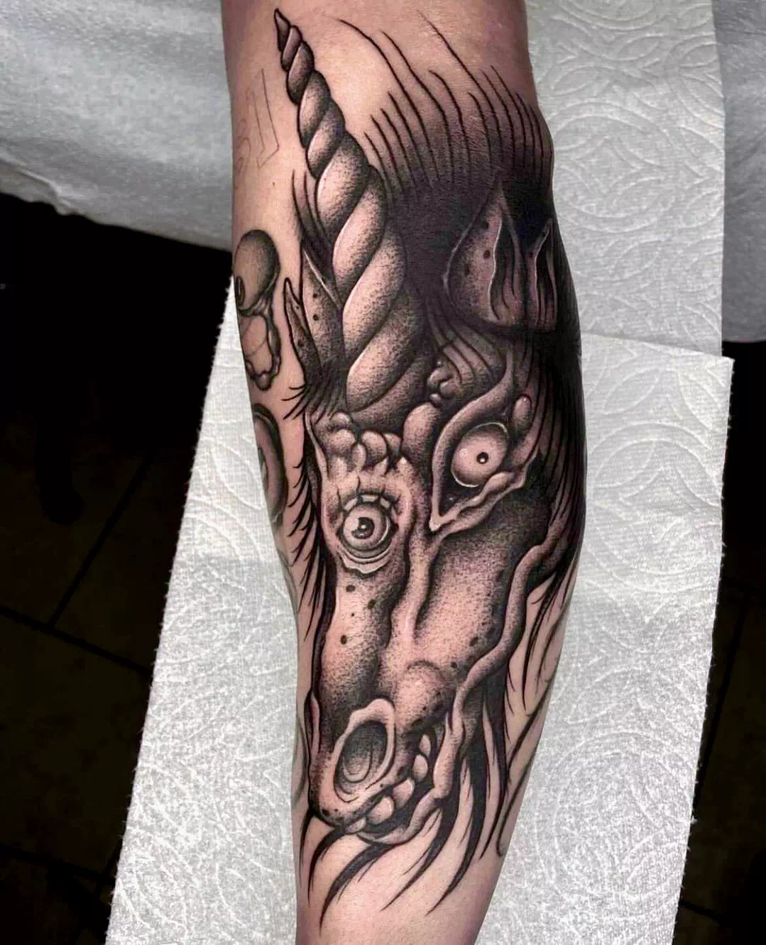 evil unicorn tattoo