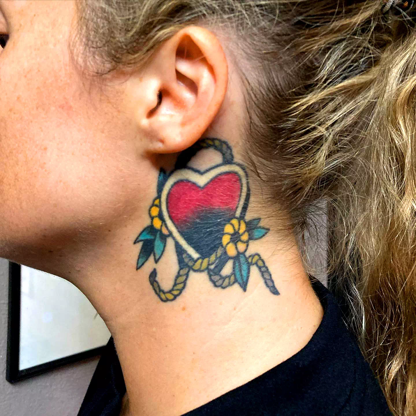 Heart neck tattoo 1