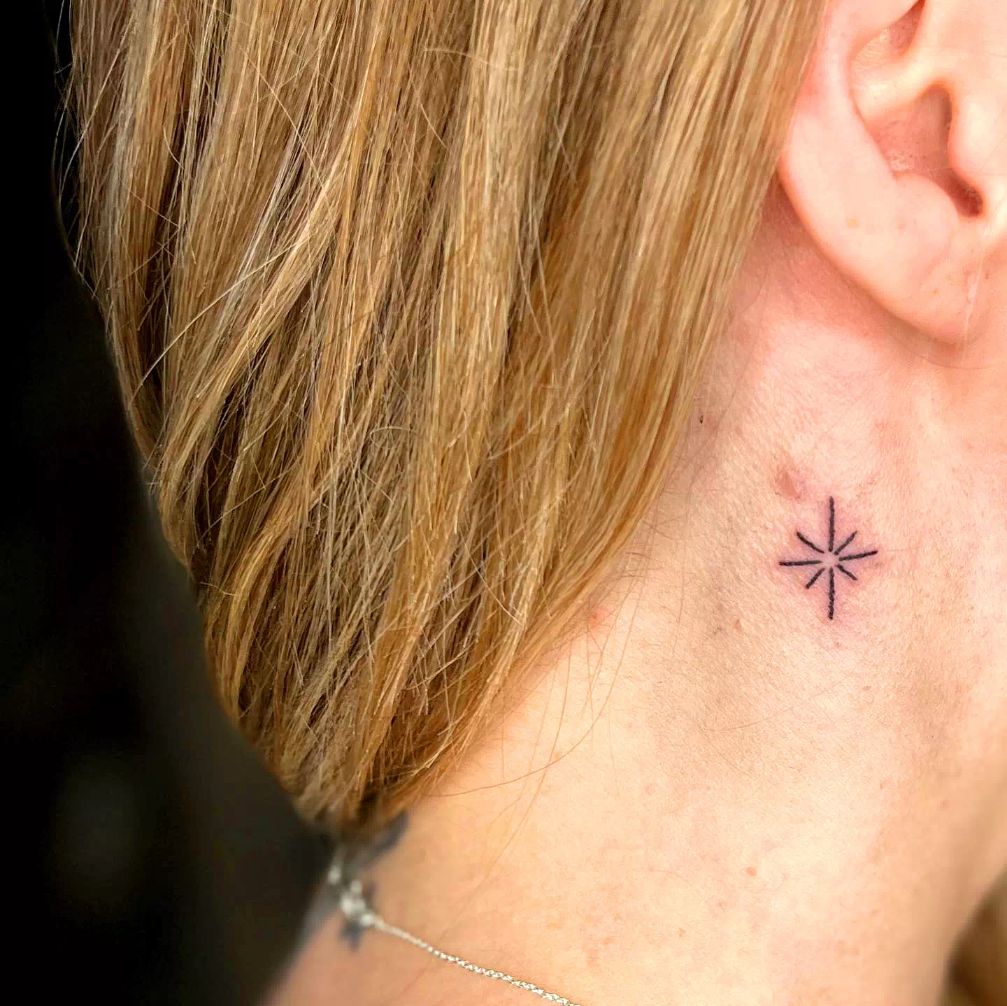 Star neck tattoo 1