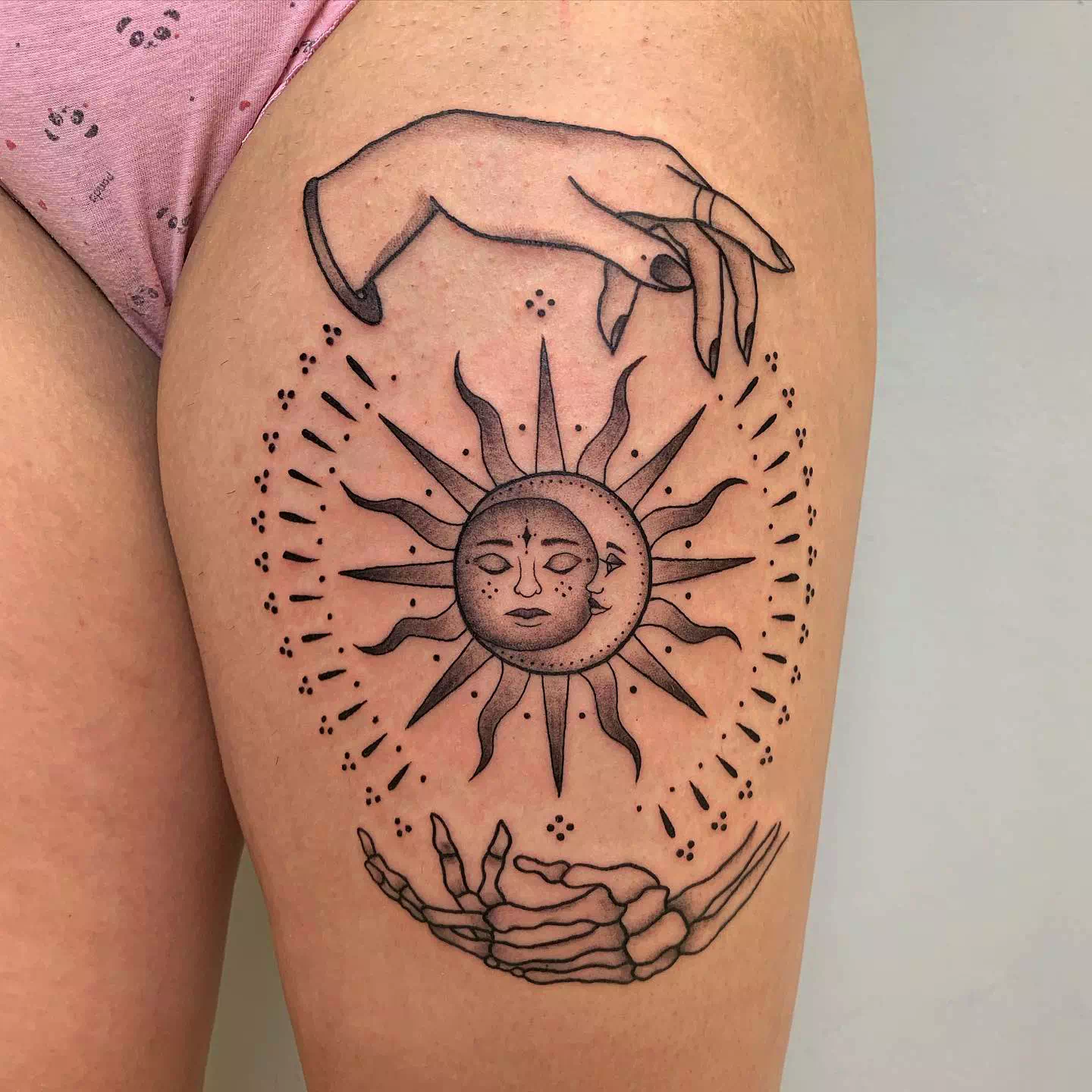 The Sun and Moon Held By Hands Tattoo Design 3