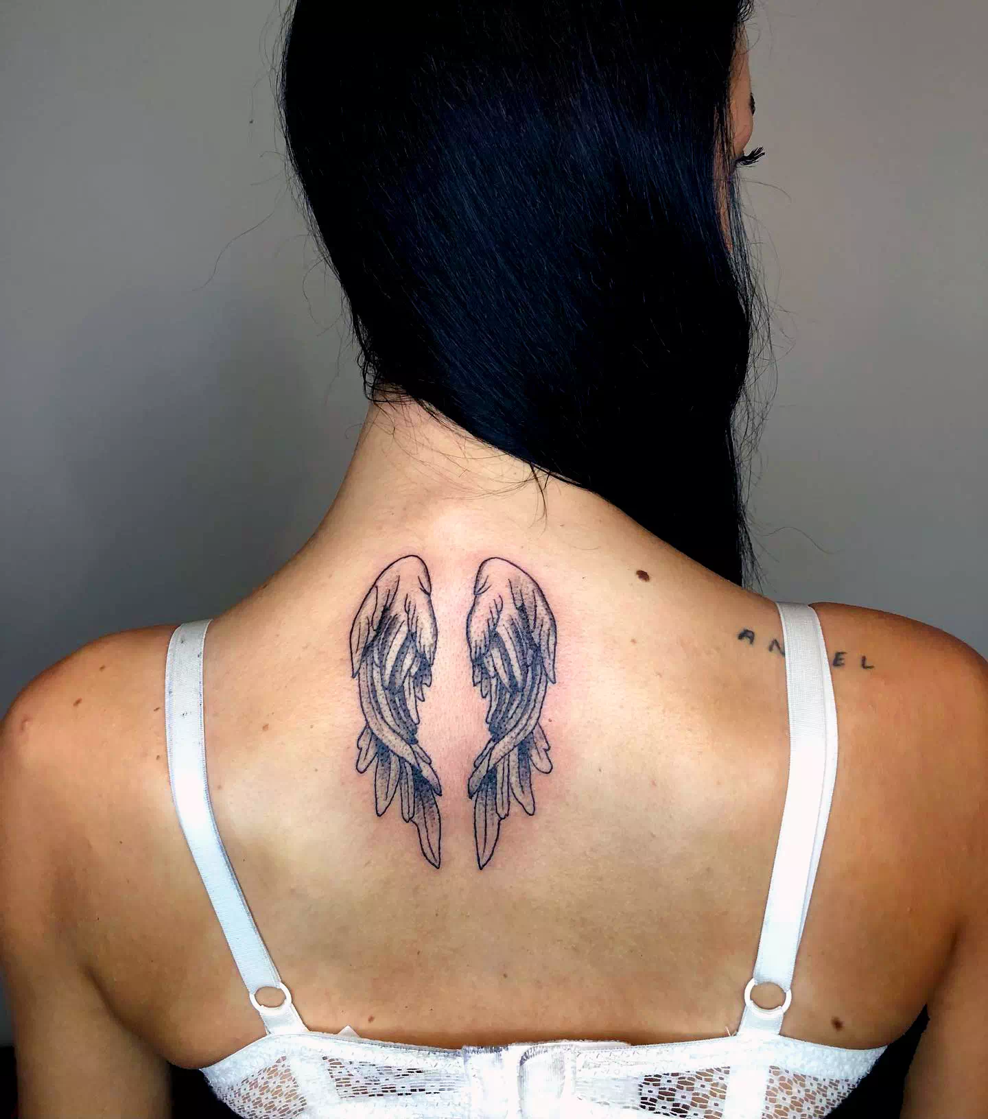 Wings neck tattoo 2
