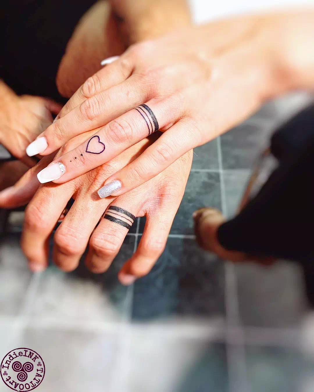 Dainty Symbols Wedding Ring Tattoo 4